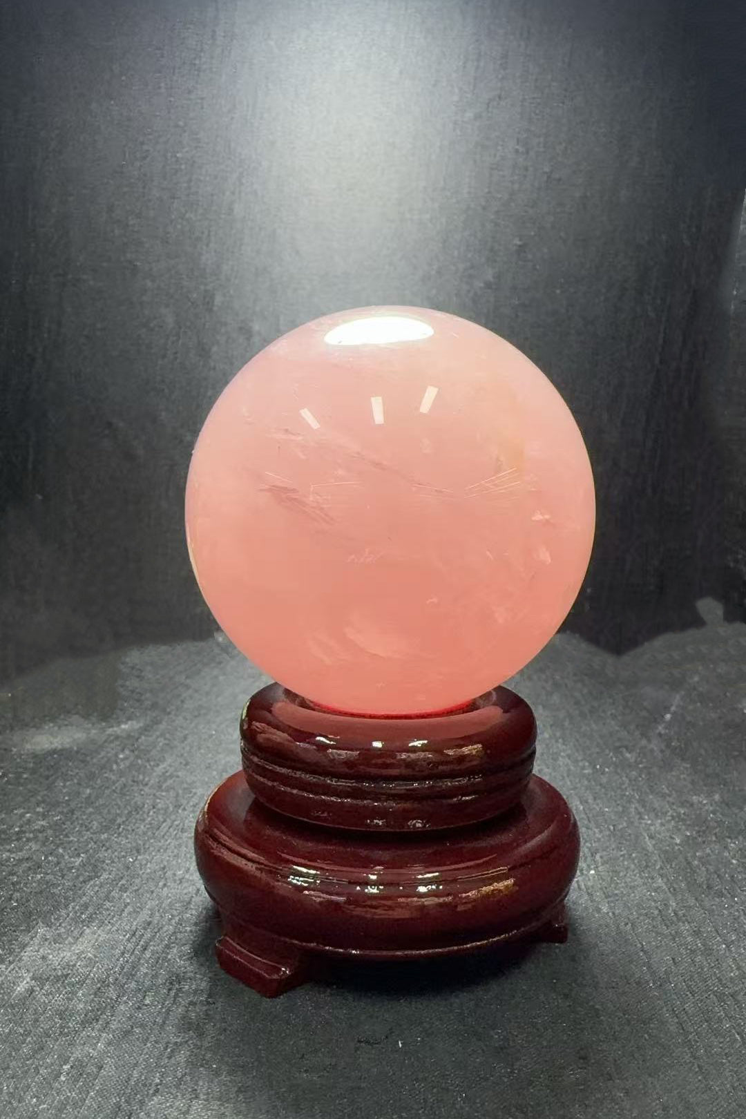 Rose Quartz Crystal Sphere on Mahogany Base