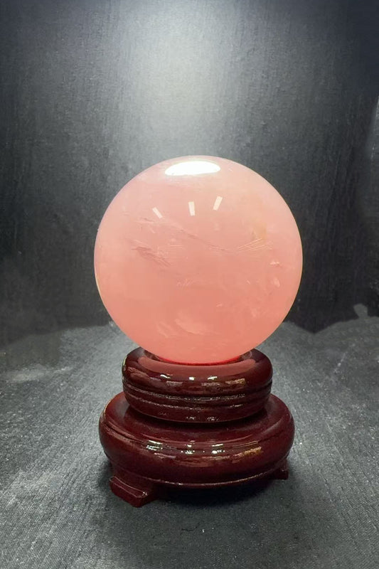 Rose Quartz Crystal Sphere on Mahogany Base